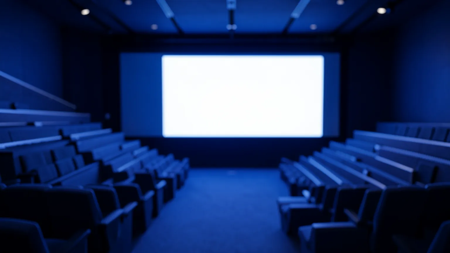 Sala de conferencias tecnológica con iluminación tenue y una pantalla azul al fondo