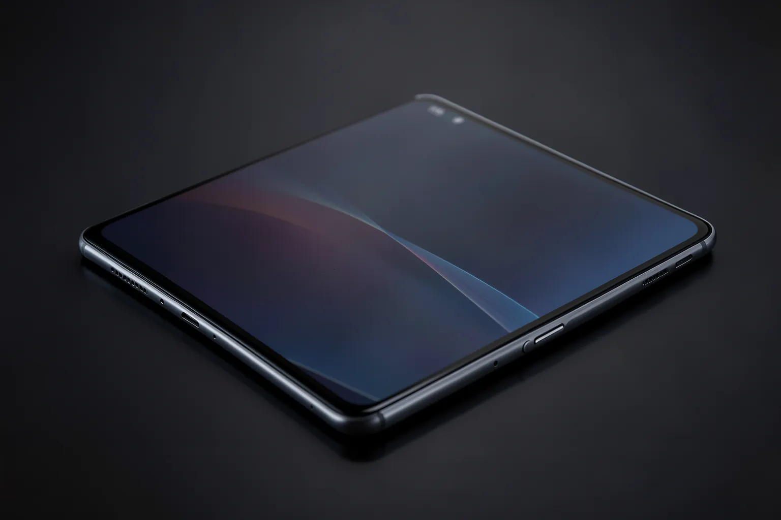 Teléfono plegable abierto mostrando una pantalla interior amplia sobre una superficie oscura